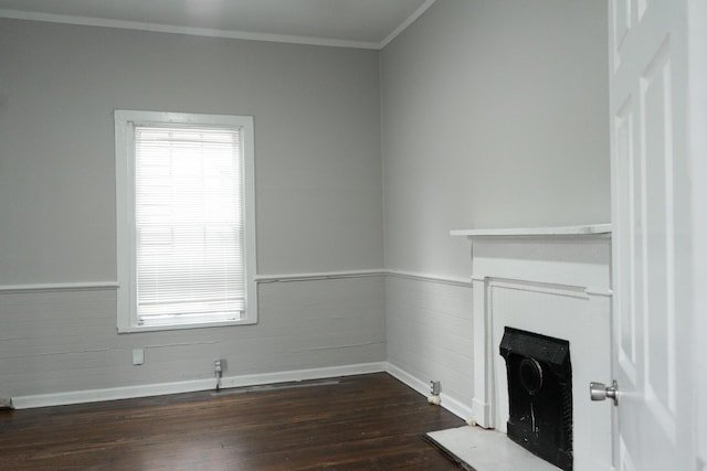 413 2nd St, Augusta, GA 30901 - unfurnished living room featuring a fireplace, ornamental molding, baseboards, wainscoting, and dark wood-style floors
