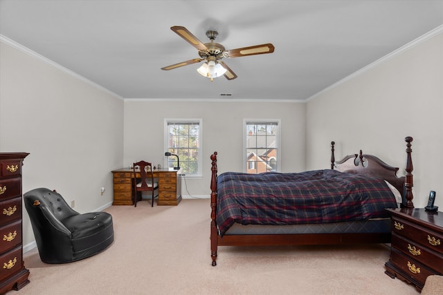 bedroom featuring ornamental molding, light colored carpet, and ceiling fan