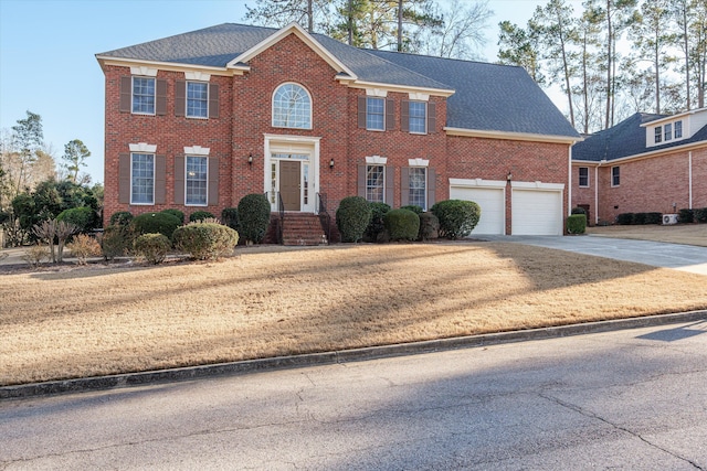 colonial home featuring a garage