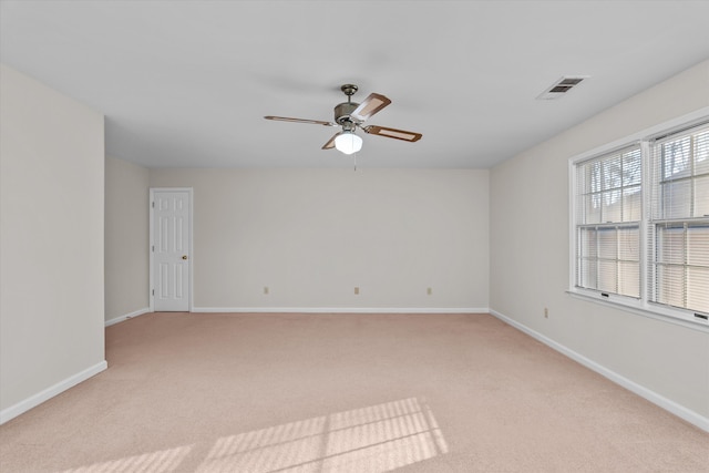 empty room with light carpet and ceiling fan