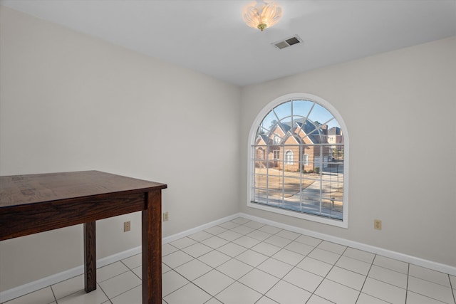 unfurnished dining area with light tile patterned floors