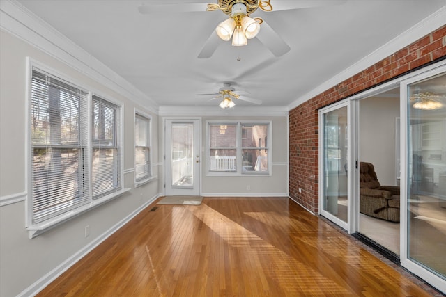 unfurnished sunroom featuring a wealth of natural light