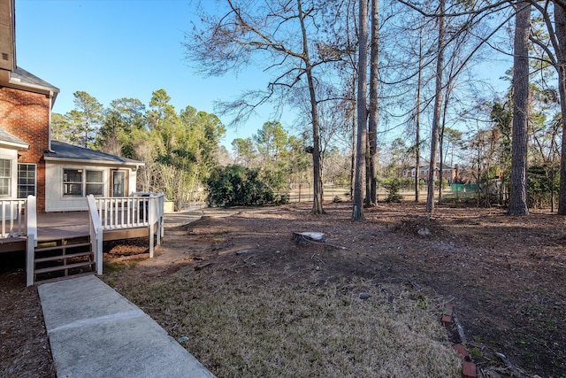 view of yard with a deck