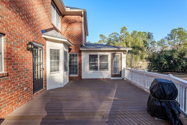 wooden terrace featuring grilling area