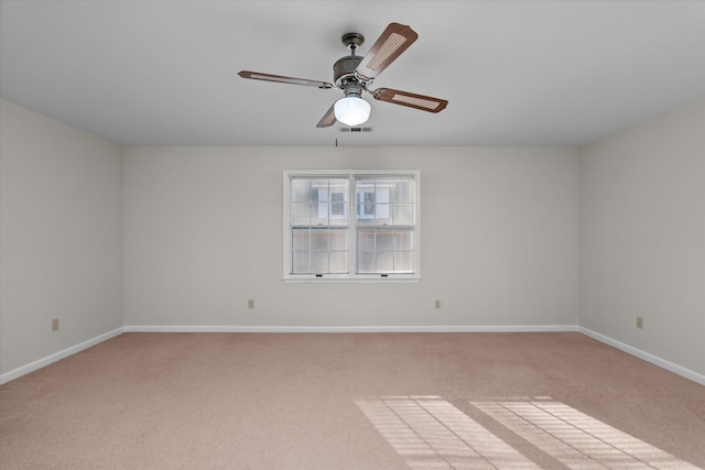 unfurnished room with light carpet and ceiling fan