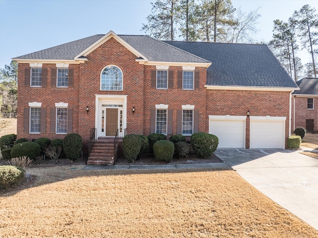 colonial home with a garage