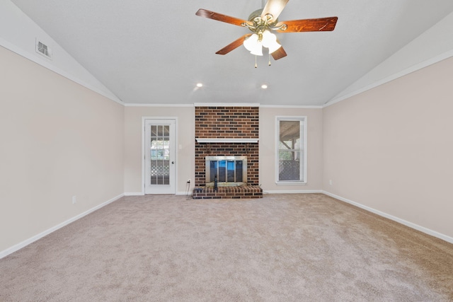 unfurnished living room featuring ceiling fan, lofted ceiling, ornamental molding, and plenty of natural light