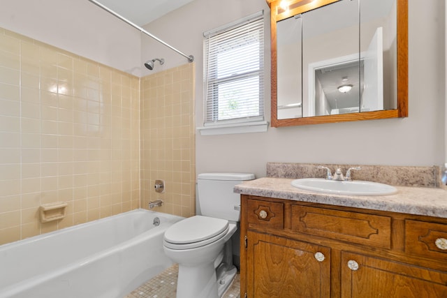 full bathroom featuring tile patterned flooring, toilet, vanity, and bathing tub / shower combination