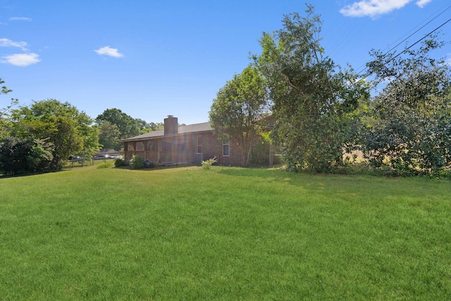 view of yard with a sunroom