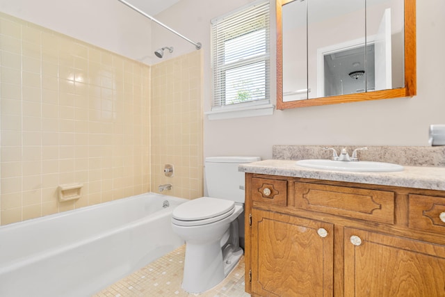 bathroom with shower / bathtub combination, vanity, tile patterned flooring, and toilet