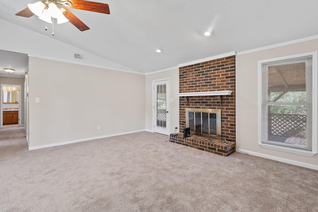 unfurnished living room with vaulted ceiling, carpet floors, and baseboards