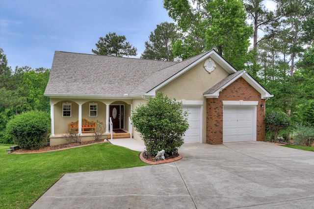 single story home featuring a front lawn, a porch, and a garage