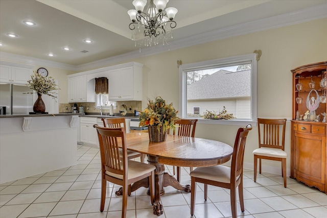 dining area featuring ornamental molding, light tile patterned floors, sink, and an inviting chandelier