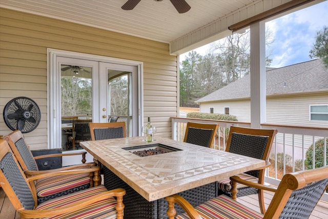 wooden terrace featuring ceiling fan