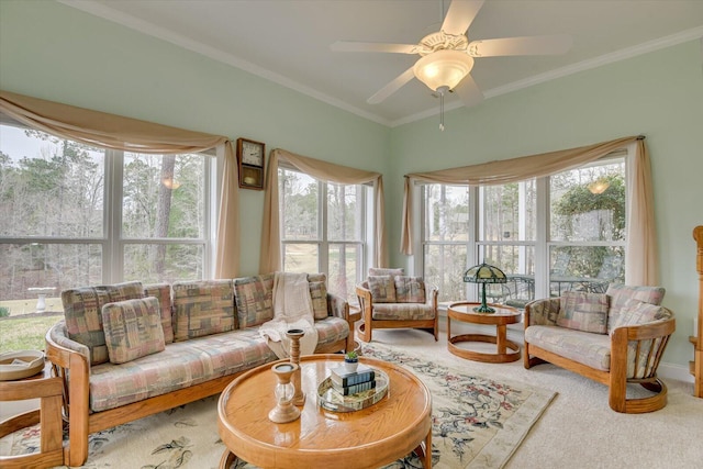 sunroom / solarium featuring ceiling fan