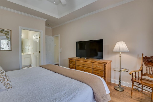 bedroom featuring ceiling fan, crown molding, wood-type flooring, and ensuite bathroom