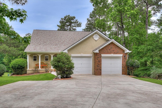 ranch-style house featuring a porch and a garage