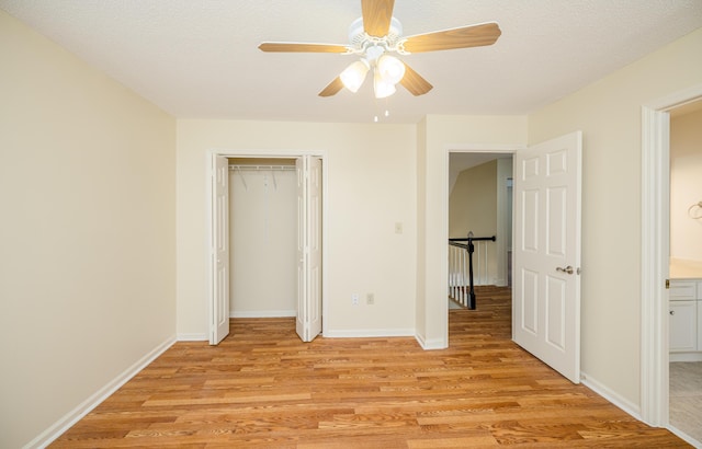 3701 Wexford Dr, Martinez, GA 30907 - unfurnished bedroom with light wood-type flooring, a closet, and a ceiling fan