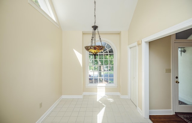 3701 Wexford Dr, Martinez, GA 30907 - unfurnished dining area featuring lofted ceiling, light tile patterned floors, and a chandelier