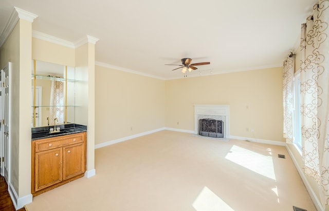 3701 Wexford Dr, Martinez, GA 30907 - unfurnished living room featuring a fireplace with flush hearth, ornamental molding, a ceiling fan, and light carpet