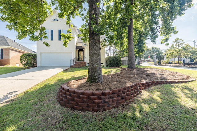 3701 Wexford Dr, Martinez, GA 30907 - view of front of property with stucco siding, an attached garage, concrete driveway, and a front lawn
