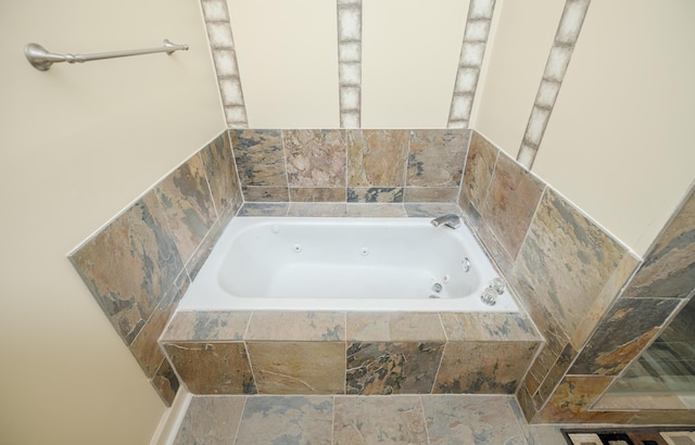 3701 Wexford Dr, Martinez, GA 30907 - bathroom featuring a tub with jets and stone finish floors
