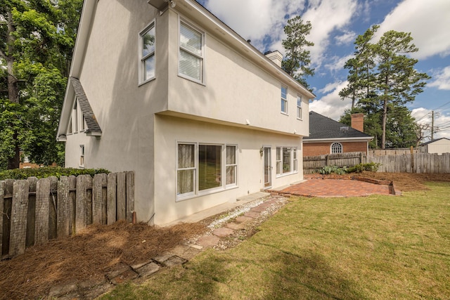 3701 Wexford Dr, Martinez, GA 30907 - back of house with a patio, a chimney, and stucco siding