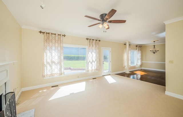 3701 Wexford Dr, Martinez, GA 30907 - unfurnished living room featuring ornamental molding, a premium fireplace, a chandelier, a ceiling fan, and carpet floors