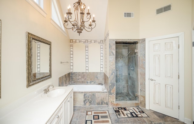 3701 Wexford Dr, Martinez, GA 30907 - full bath featuring a garden tub, a towering ceiling, a shower stall, vanity, and a chandelier