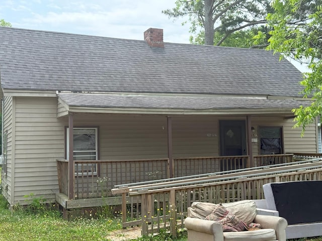 205 Addison St, Johnston, SC 29832 - back of property with roof with shingles, a chimney, and a porch