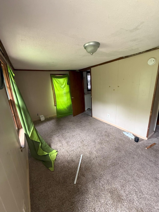 205 Addison St, Johnston, SC 29832 - carpeted spare room with a textured ceiling and baseboards
