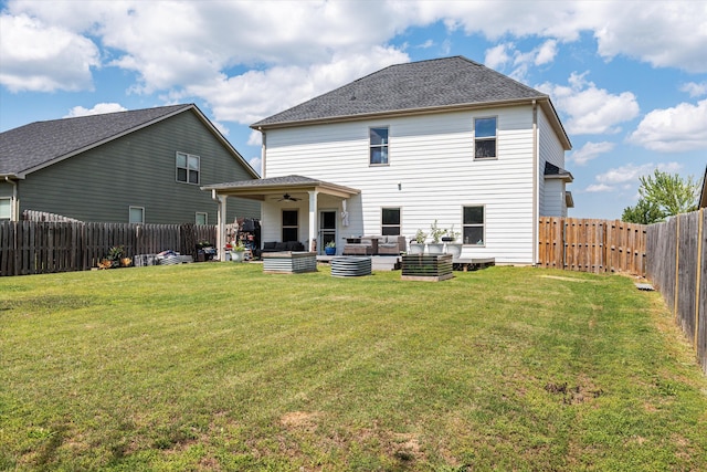 back of property featuring outdoor lounge area, a fenced backyard, a ceiling fan, a lawn, and roof with shingles