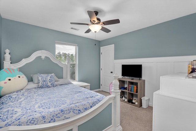bedroom featuring washer / clothes dryer, a ceiling fan, visible vents, and carpet floors