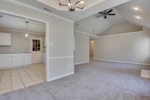 3650 Crawfordville Dr, Augusta, GA 30909 - unfurnished living room with a chandelier, a ceiling fan, light colored carpet, ornamental molding, and vaulted ceiling