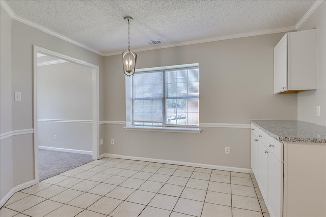 3650 Crawfordville Dr, Augusta, GA 30909 - unfurnished dining area featuring a textured ceiling, ornamental molding, and a chandelier