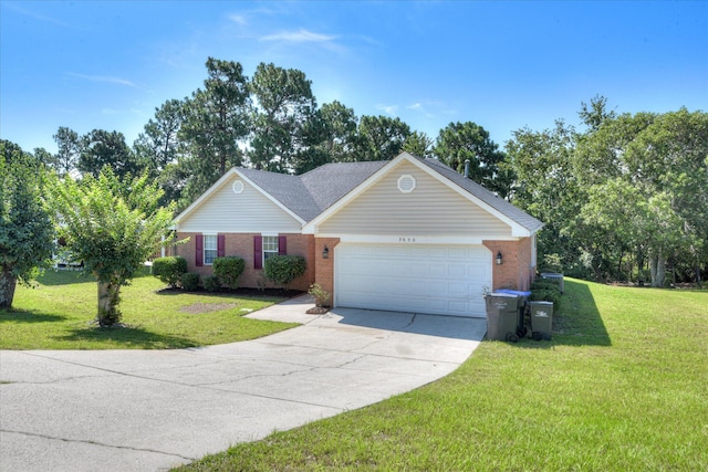3650 Crawfordville Dr, Augusta, GA 30909 - view of front of home with a garage, a front yard, brick siding, and concrete driveway