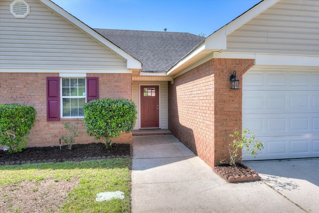 3650 Crawfordville Dr, Augusta, GA 30909 - property entrance with a garage, roof with shingles, and brick siding