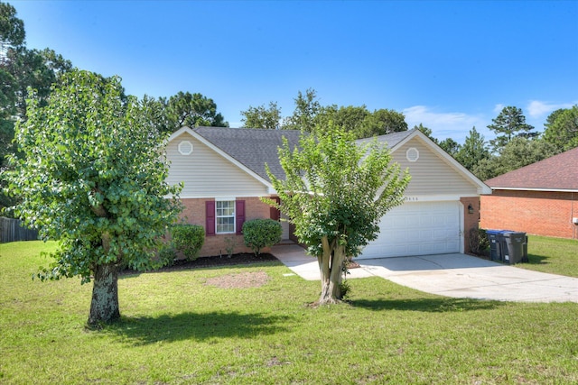 3650 Crawfordville Dr, Augusta, GA 30909 - view of front facade featuring concrete driveway, an attached garage, brick siding, and a front yard