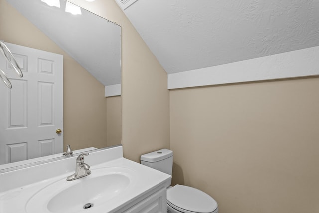 1094 Hampstead Pl, Martinez, GA 30907 - half bath featuring lofted ceiling, vanity, and a textured ceiling