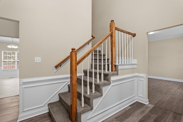 1094 Hampstead Pl, Martinez, GA 30907 - stairs with wood finished floors, a chandelier, and ornamental molding
