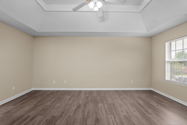 1094 Hampstead Pl, Martinez, GA 30907 - empty room with a raised ceiling, dark wood-type flooring, and a ceiling fan
