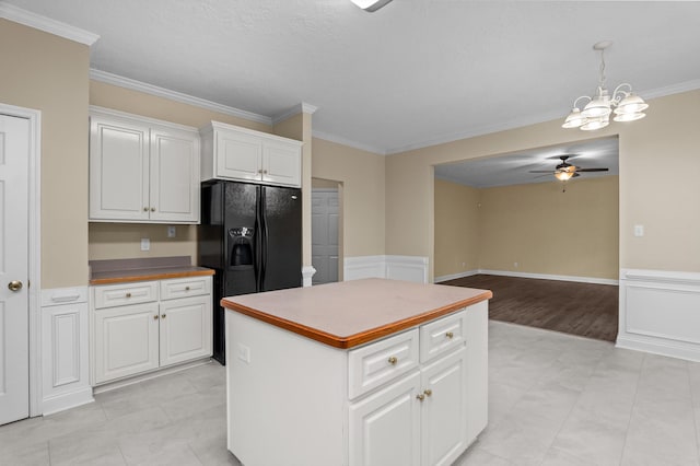 1094 Hampstead Pl, Martinez, GA 30907 - kitchen featuring a ceiling fan, a kitchen island, ornamental molding, white cabinetry, and a chandelier
