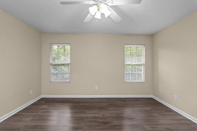 1094 Hampstead Pl, Martinez, GA 30907 - spare room with healthy amount of natural light, dark wood-style flooring, a ceiling fan, and a textured ceiling