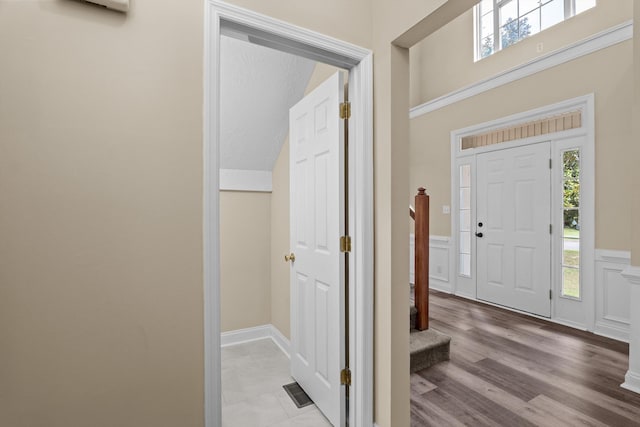 1094 Hampstead Pl, Martinez, GA 30907 - entrance foyer with wainscoting, plenty of natural light, a decorative wall, and light wood-style floors
