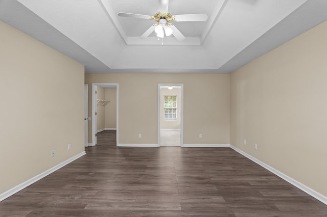 1094 Hampstead Pl, Martinez, GA 30907 - unfurnished room with a raised ceiling, a ceiling fan, and dark wood-style flooring