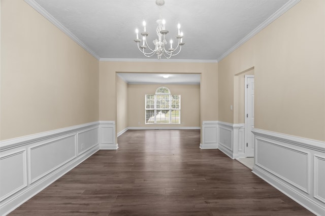 1094 Hampstead Pl, Martinez, GA 30907 - unfurnished dining area featuring a chandelier, crown molding, dark wood finished floors, wainscoting, and a decorative wall