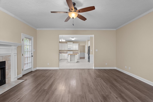 1094 Hampstead Pl, Martinez, GA 30907 - unfurnished living room with a ceiling fan, wood finished floors, a fireplace, ornamental molding, and a textured ceiling