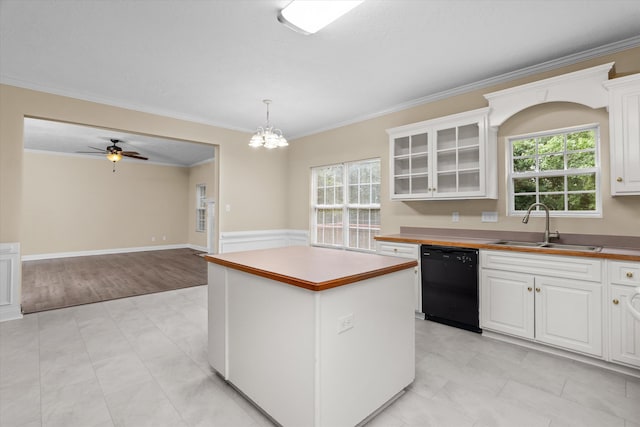 1094 Hampstead Pl, Martinez, GA 30907 - kitchen with a center island, healthy amount of natural light, dishwasher, white cabinets, and ornamental molding