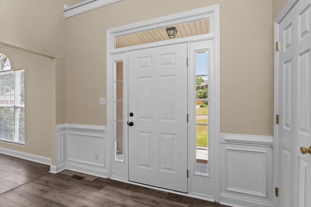 1094 Hampstead Pl, Martinez, GA 30907 - foyer featuring a wainscoted wall, dark wood-type flooring, and a decorative wall