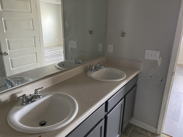 full bath with double vanity and a sink